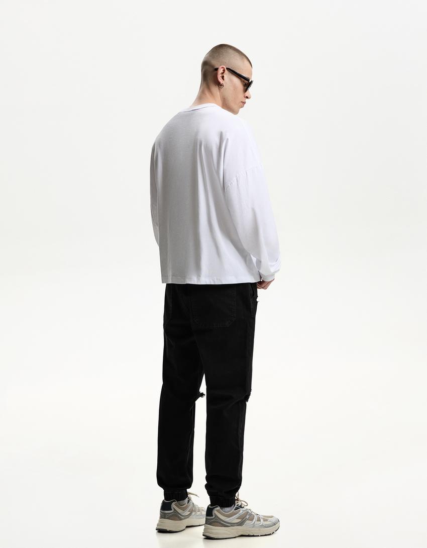 Jogger-Jeans mit Zierrissen-Schwarz-1