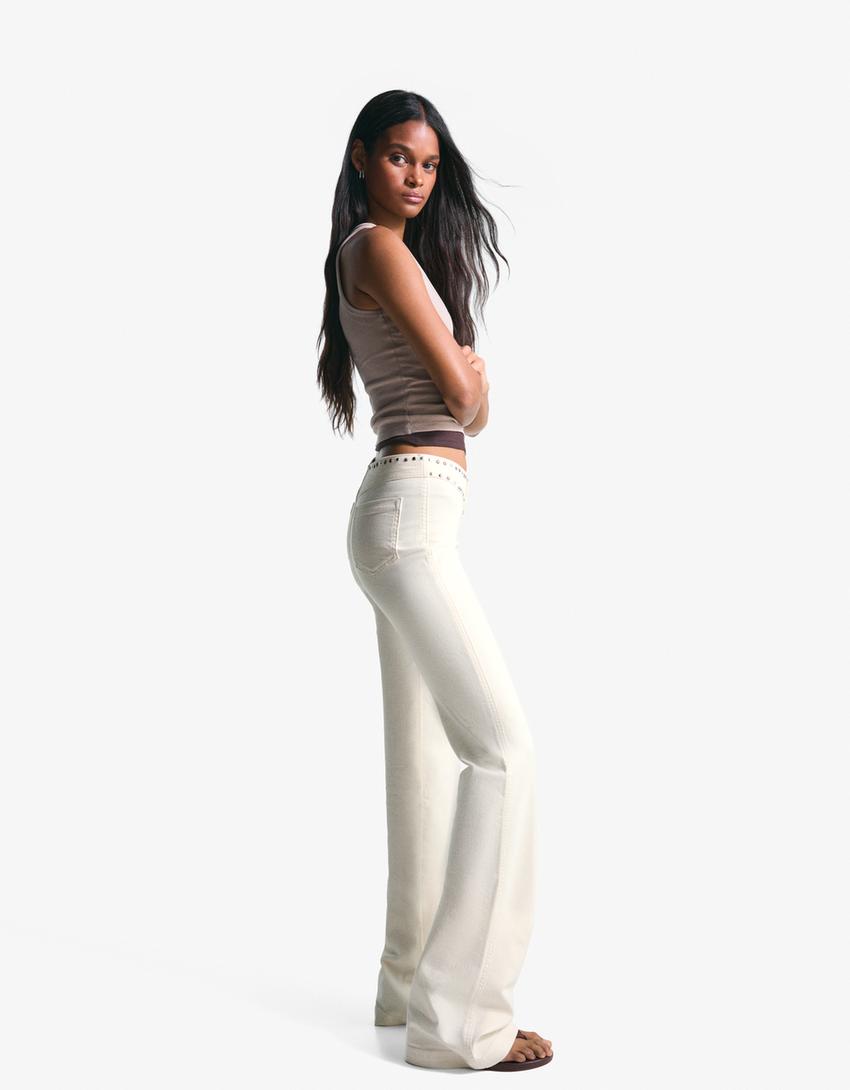 Pantaloni con borchie in vita e cerniera-Bianco Roto-2
