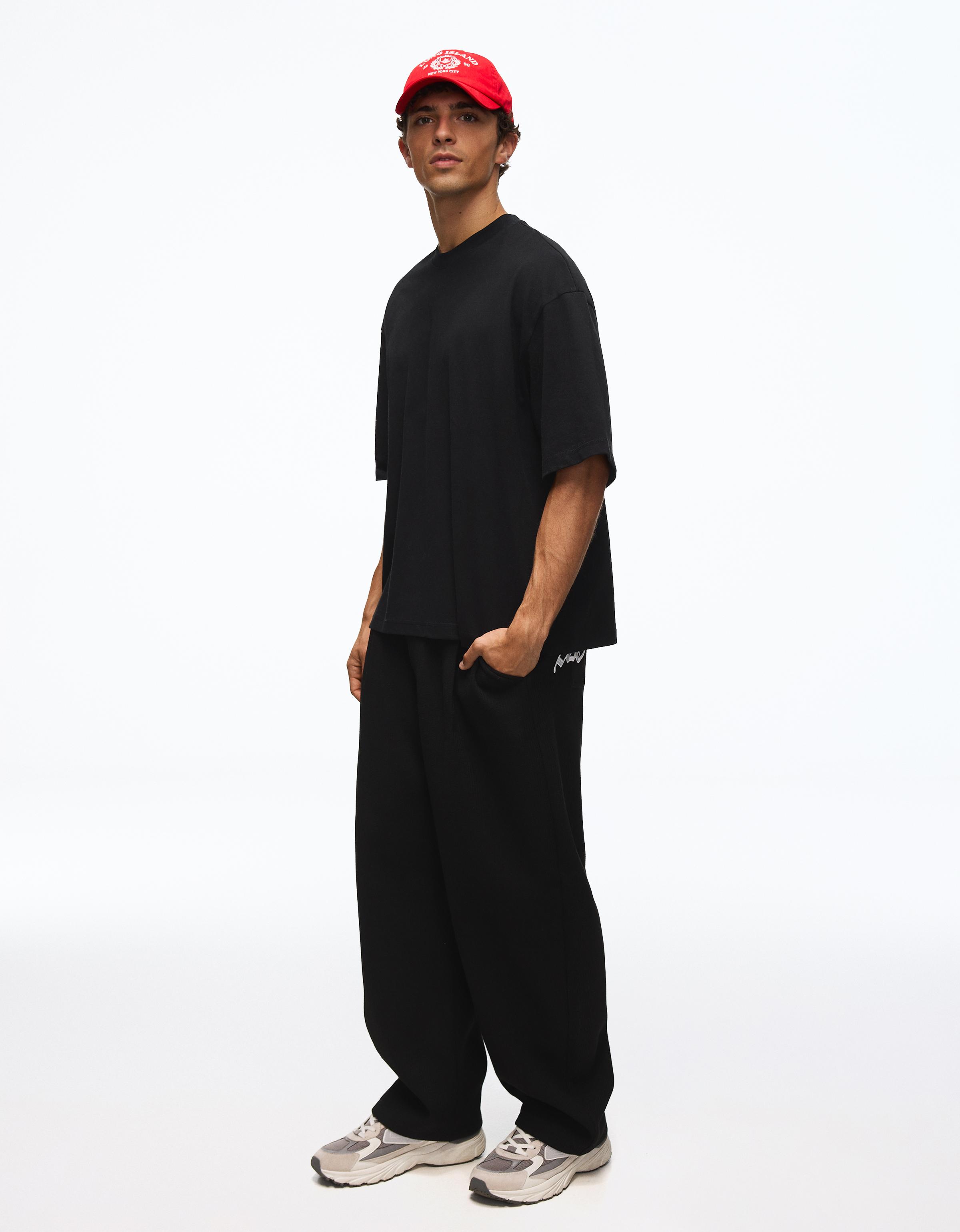 Embroidered waffle-knit balloon trousers — Black