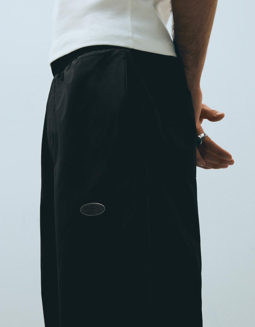 Technical barrel trousers-Black