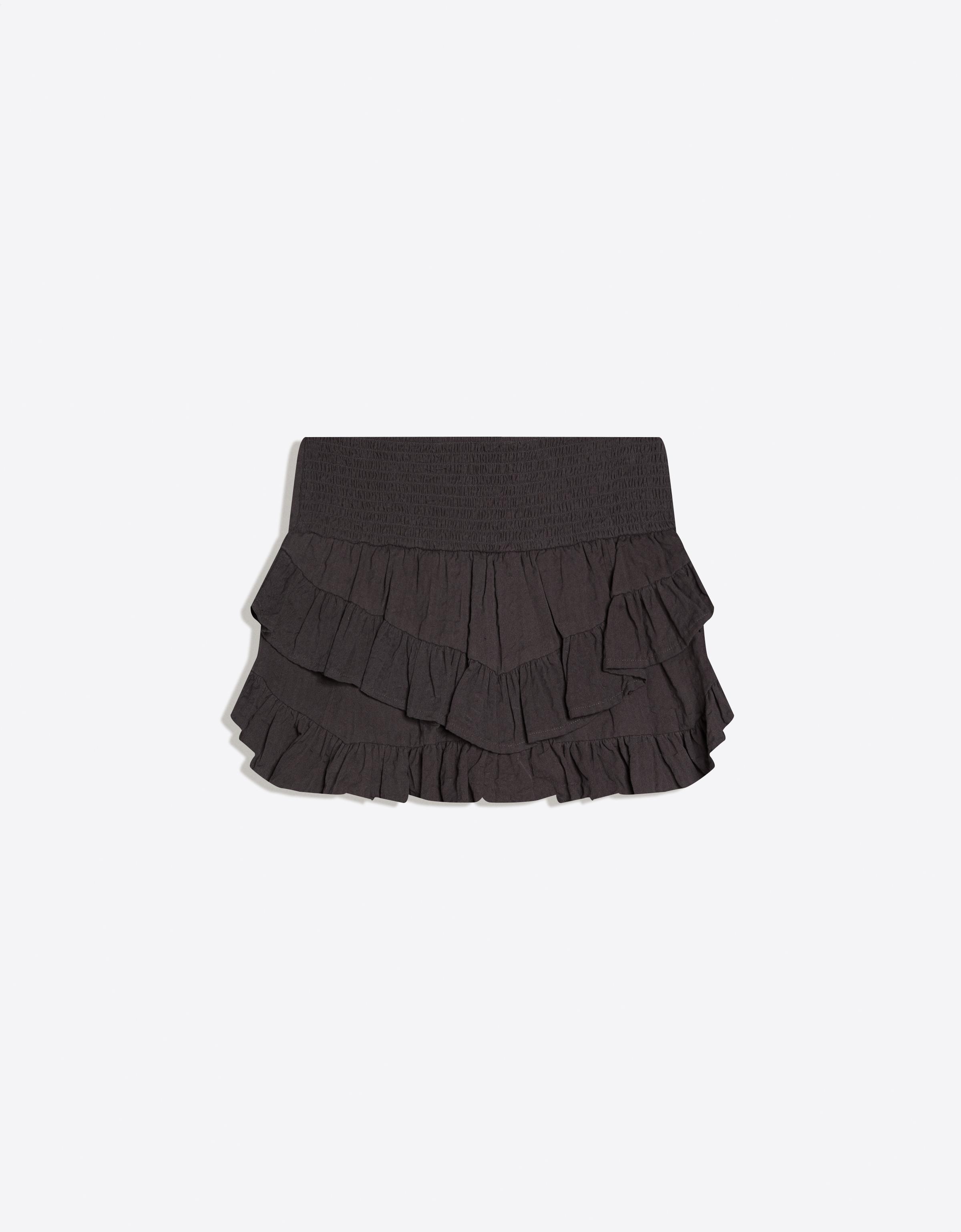 Mini skirt with ruffles and shimmery waistband