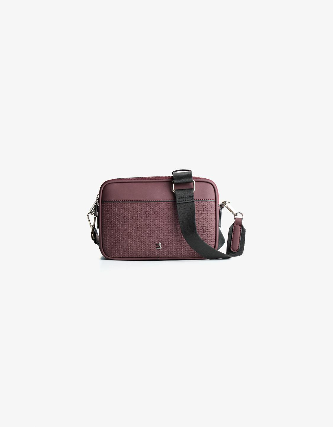 Crossbody bag with raised design