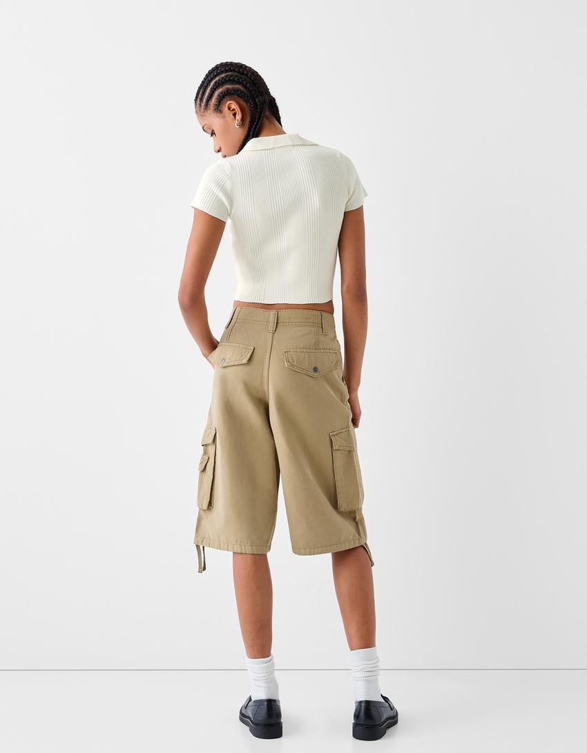 قميص بولو بأكمام قصيرة وأزرار-كريمي-1