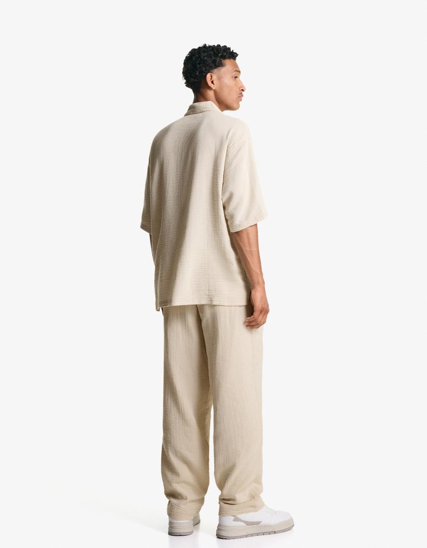 Spodnie o kroju wide leg z krepy-Piaskowy-1