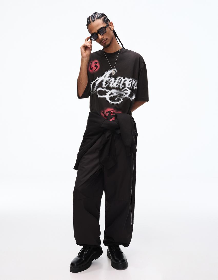 Boxy T-Shirt mit kurzen Ärmeln und Print-Schwarz