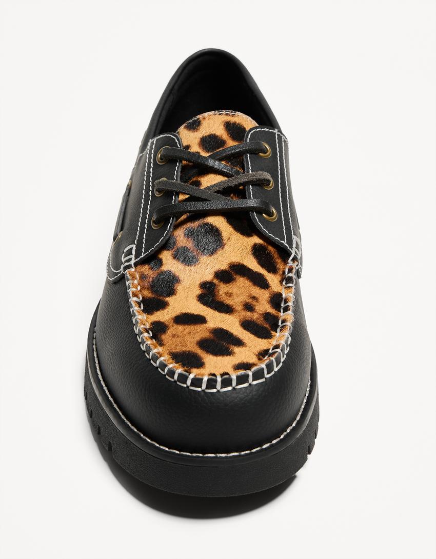 Animal print deck shoes