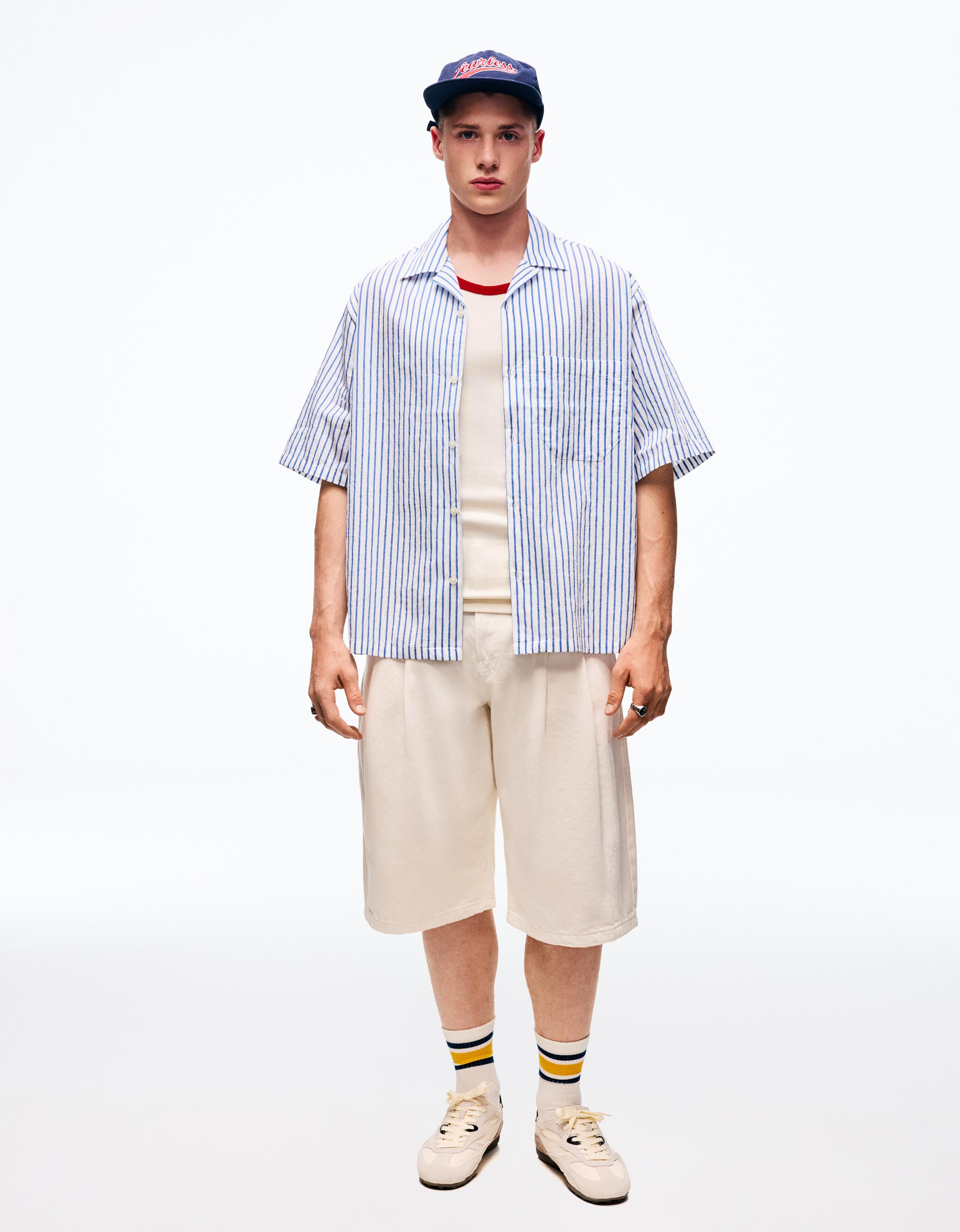 Short-sleeved striped shirt — Light blue