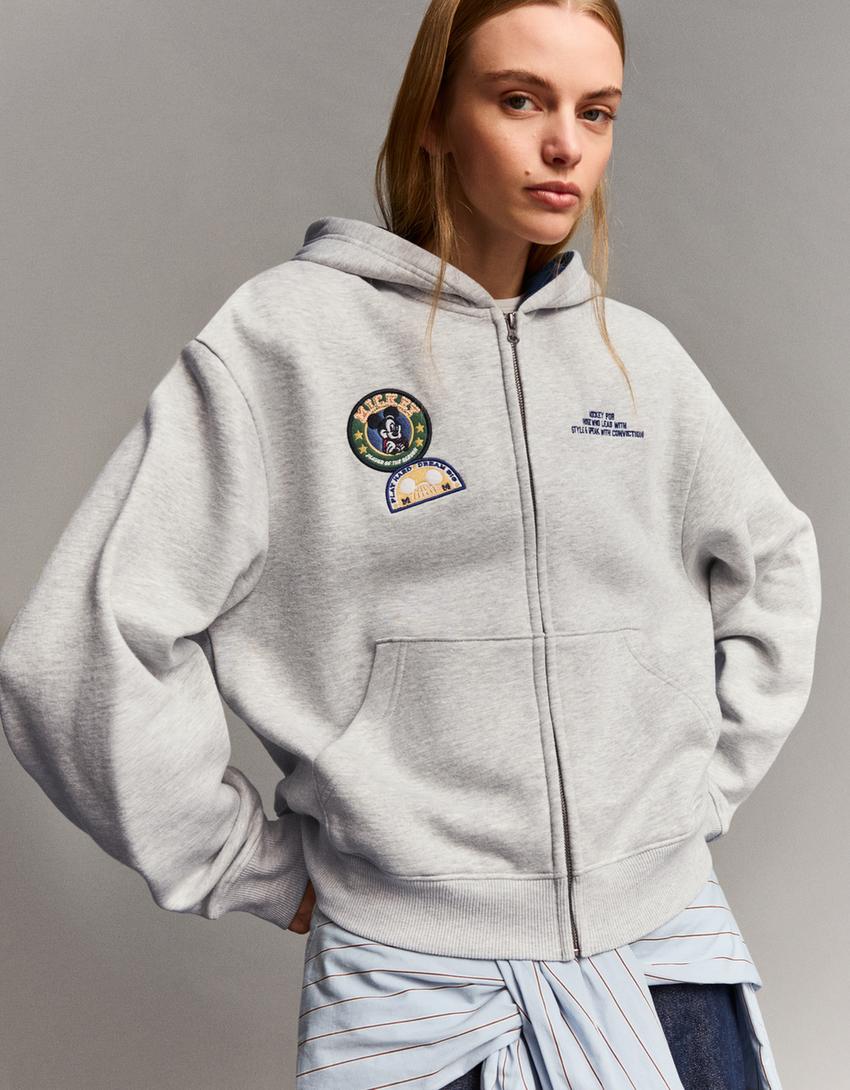 Dessuadora cremallera Disney cropped estampat-Gris