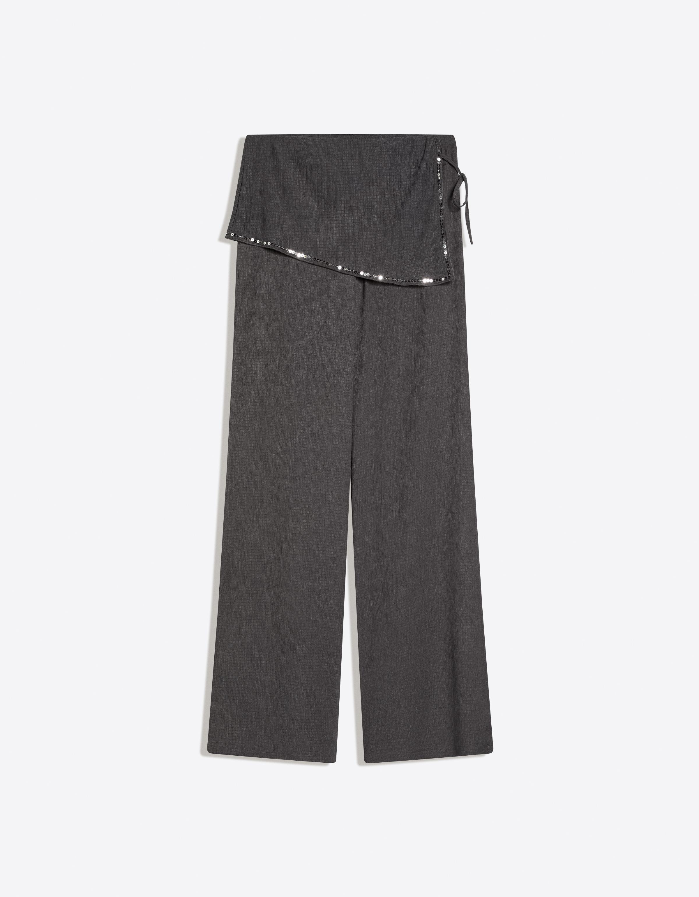 Trousers with sequin overskirt