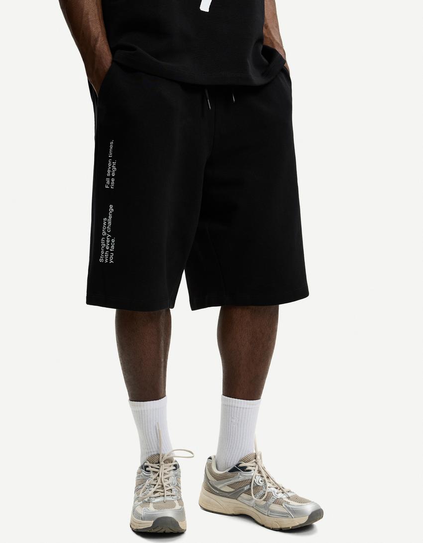 Plush Bermuda shorts with print-Black