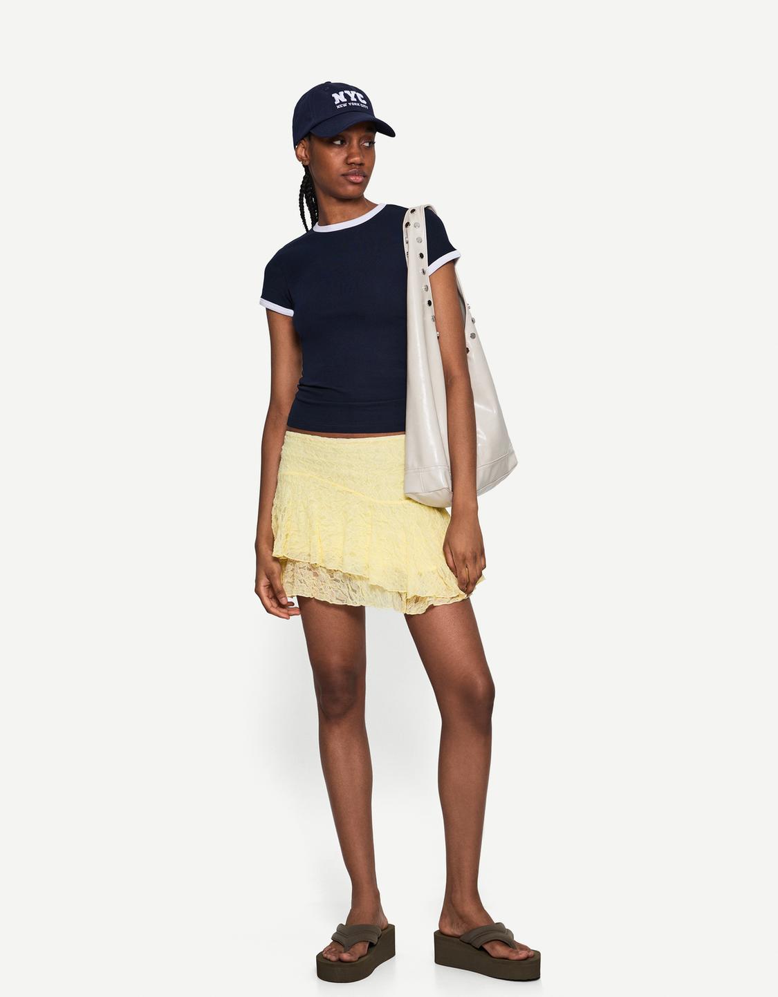 Ruffled blonde lace mini skirt