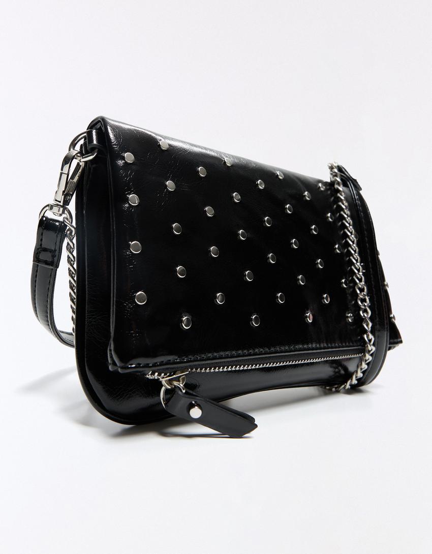 Bolso sobre tachas-Negro